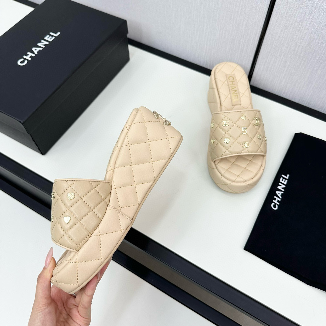 CHANEL hardware embroidered wedge slippers