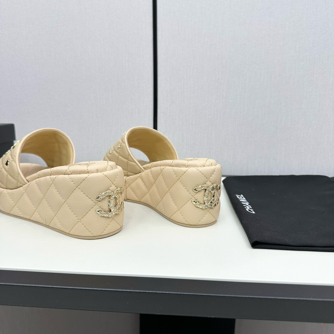 CHANEL hardware embroidered wedge slippers